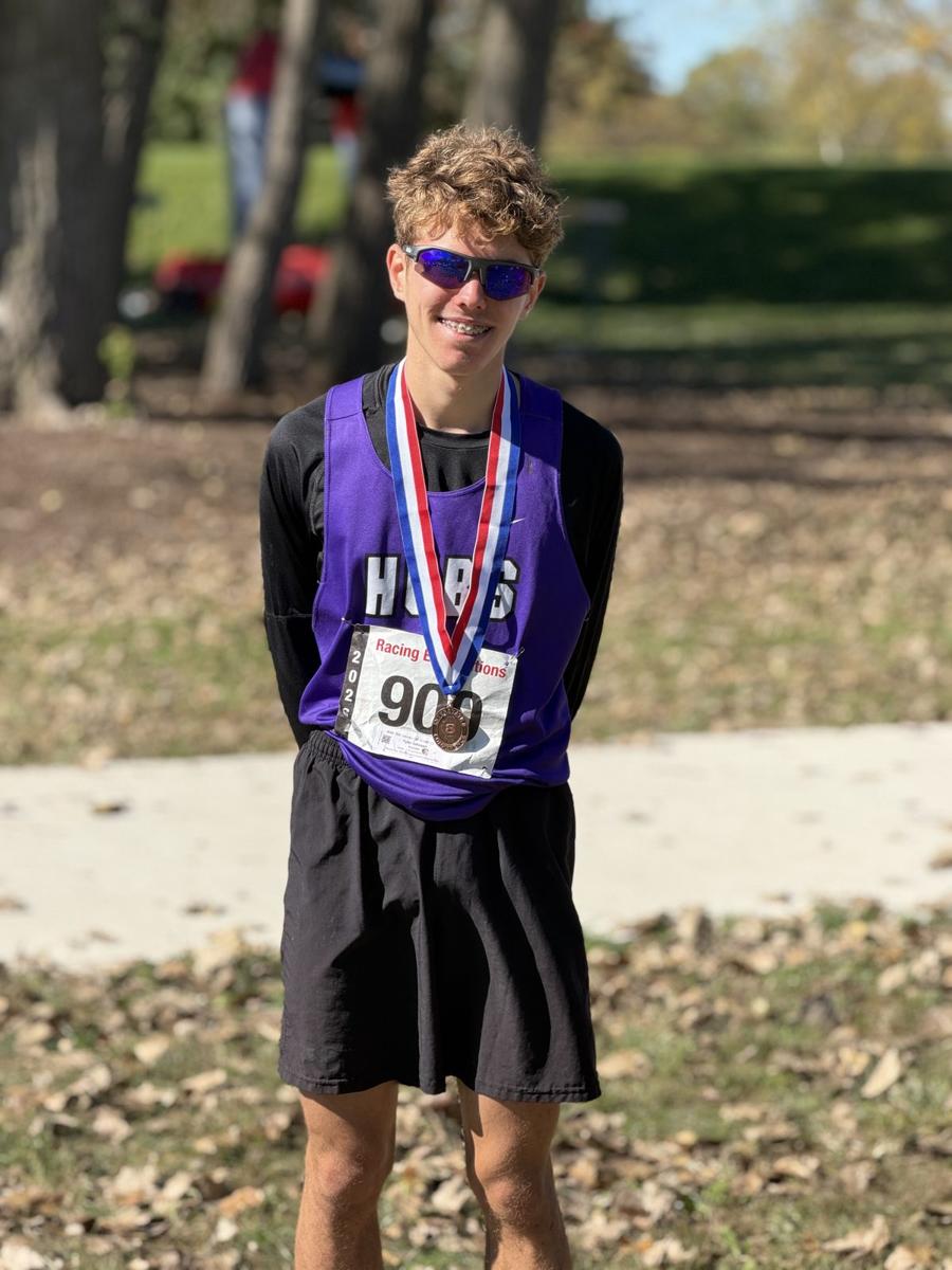 Tyler Johnson with his medal at the I8 Conference meet
