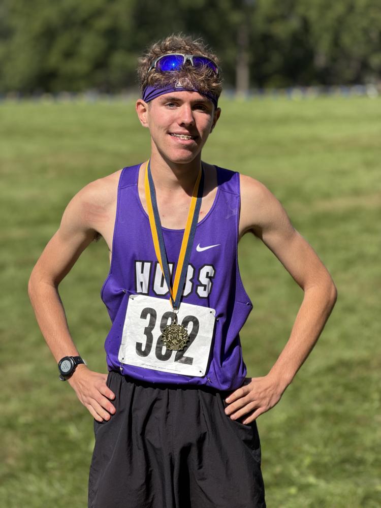 Tyler Johnson with his medal at the Rock River Run